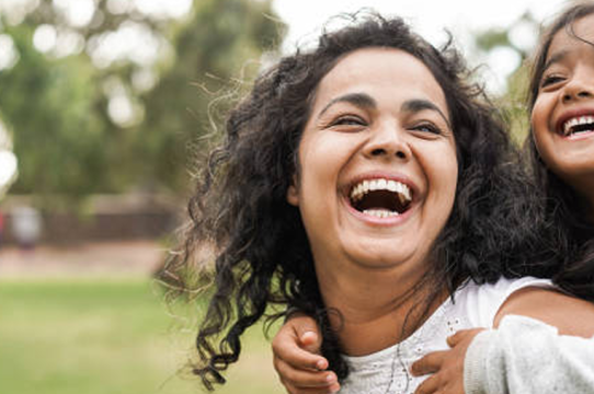 Mother and daughter smiling