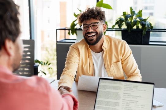 Smiling man meeting with an advocate