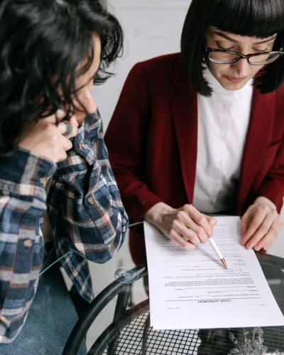 Legal advocate reviewing a document with a client.